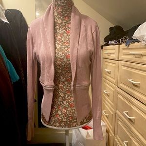 Cute pink cardigan with zipper accent.